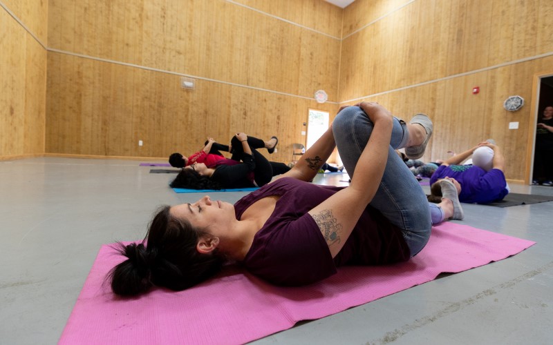 Patients stretch during a yoga session at Cove Forge Behavioral Health